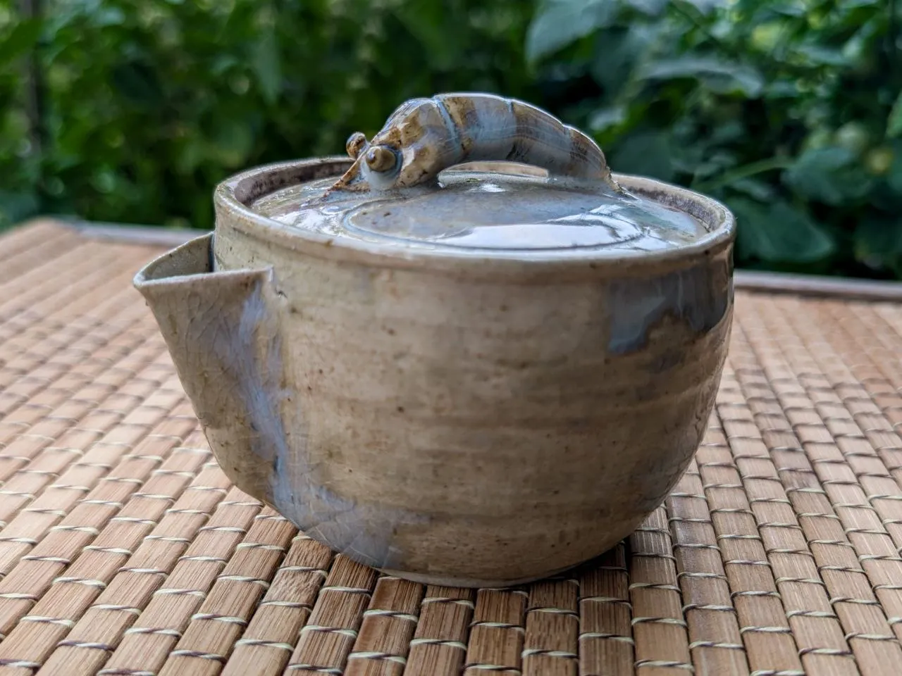 Clay teapot with a shrimp-shaped lid